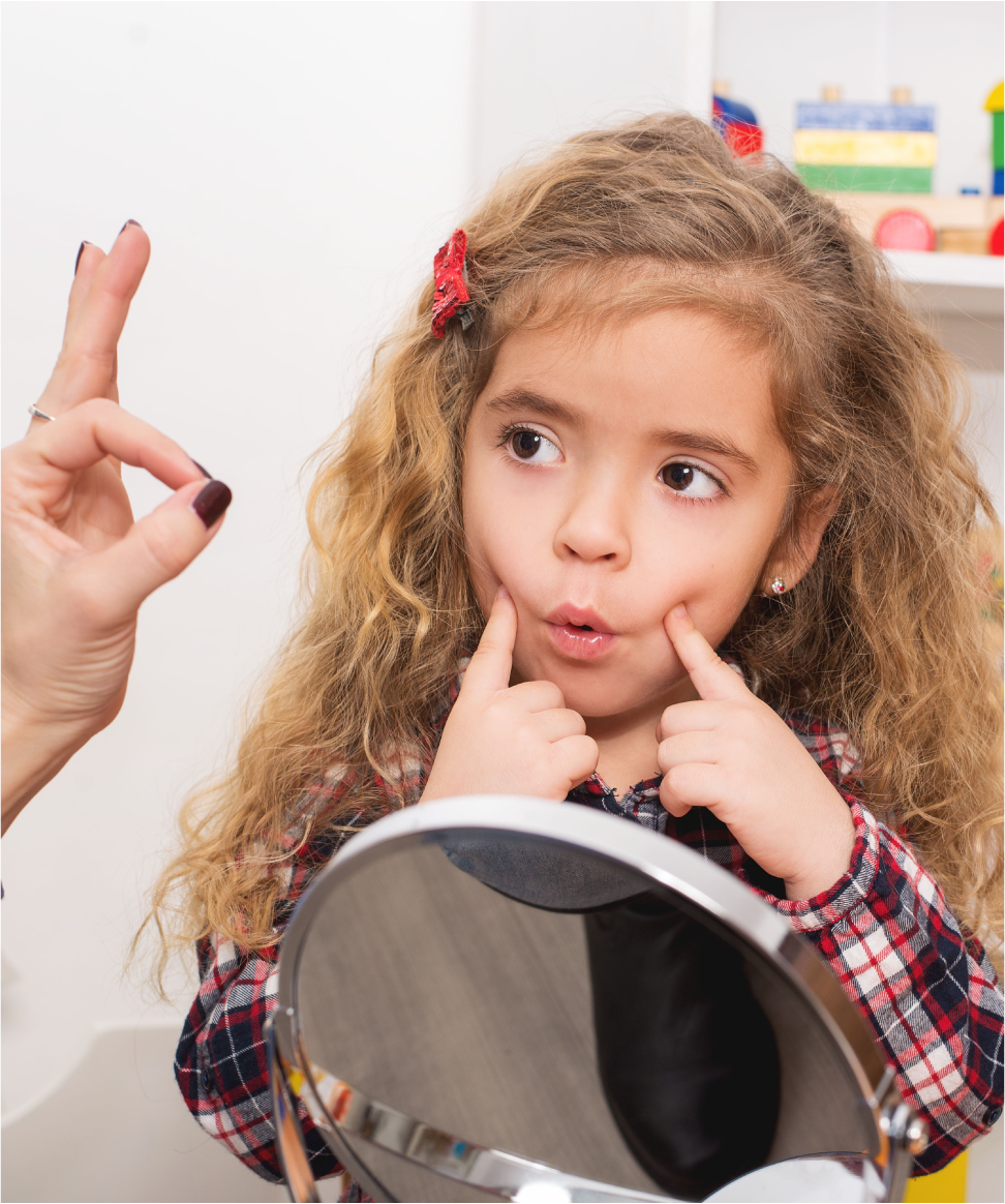 Girl practicing mouth sounds